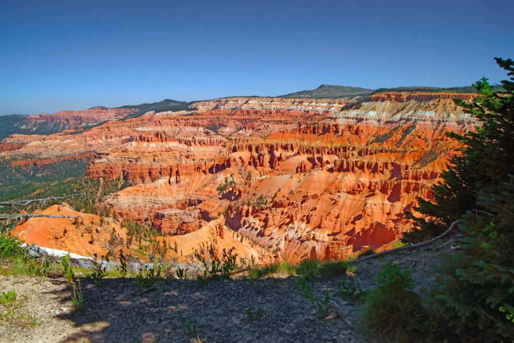 A breathtaking view from Bryce Canyon, revealing the intricate landscape and vibrant hues of Cedar Breaks National Monument. | Cedar Breaks National Monument: The Ultimate Destination for Hikers - The Explore Horizon